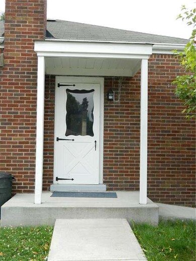 Covered side porch convenient to kitchen to bring 
