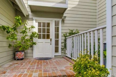 Charming and private front entry with brick porch 