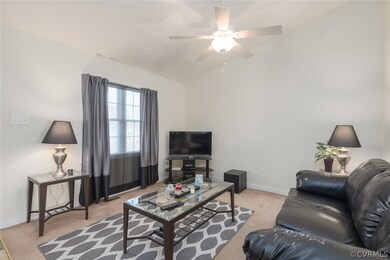 Vaulted Ceiling in Living and has Ceiling Fan with
