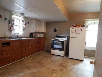 Large kitchen with big eat-in-area and pantry.