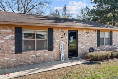 Entrance to property with brick siding