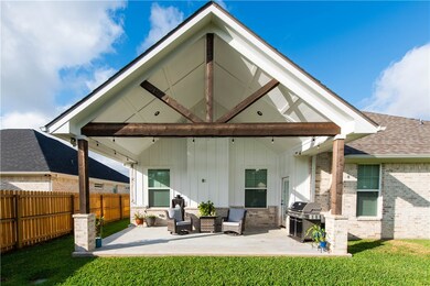 Back of house featuring an outdoor living space, a