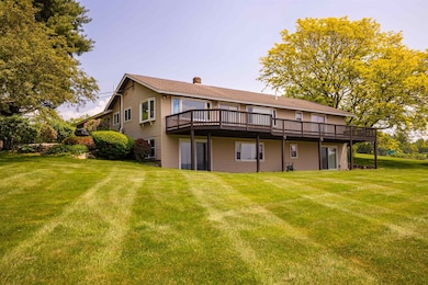 Back view, offers deck which goes from North to South