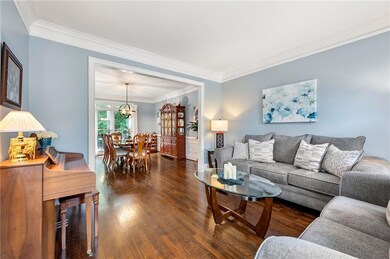Whether you’re catching up with friends or cozying up with a book, this peaceful, light-filled living room is made for reading a book or hosting family holidays.