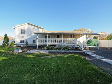 Back of house with covered porch