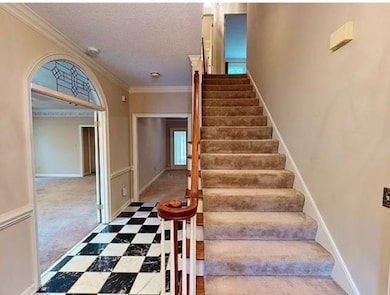 Staircase featuring tile patterned floors, ornamen