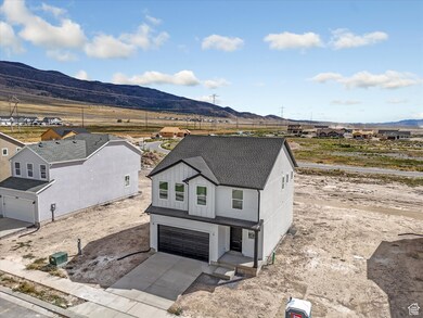 View of front of house featuring board and batten siding, a mountain view, a residential view, a shingled roof, and concrete driveway