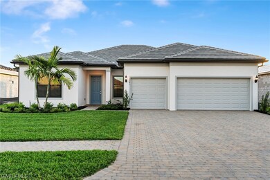 Coastal style home with 2 car/1 golf cart garage