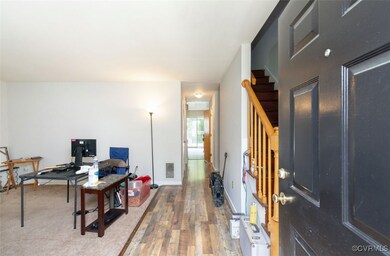 Home office featuring wood finished floors and bas