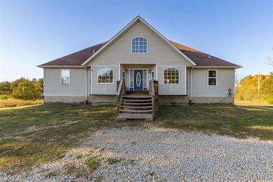 Bungalow-style house featuring a front lawn and roof with shingles