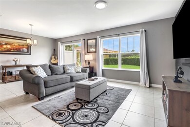 Living room featuring light tile patterned floors