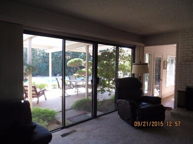 12 FEET OF SLIDERS OVER LOOKING PATIO AND POOL