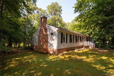 View of property exterior featuring a yard