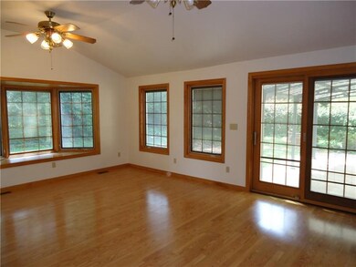 The large familyroom leads to the back yard covere