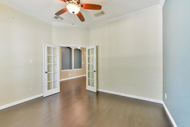 Large study with French Doors at the front of the home.