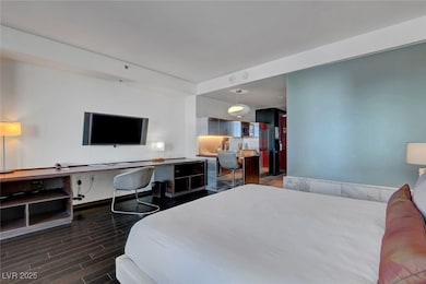 Bedroom with wood finished floors, stainless steel