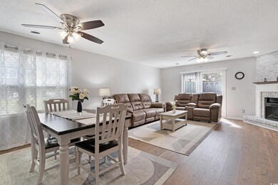 Dining space with visible vents, a ceiling fan, a 