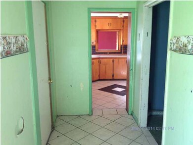 between the kitchen and dinning is the laundry tha