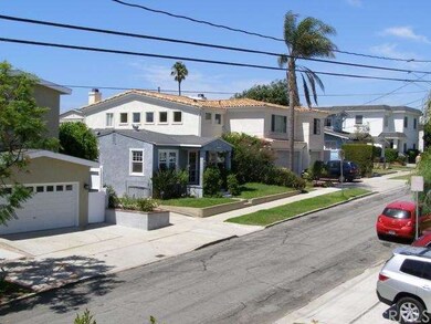 On a street with newer homes nearby.