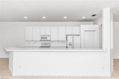 Plenty of area for barstools and lots of storage!