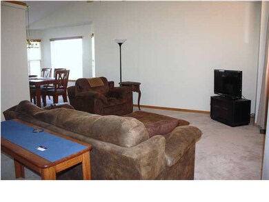 LIVING ROOM OPENS TO THE DINING