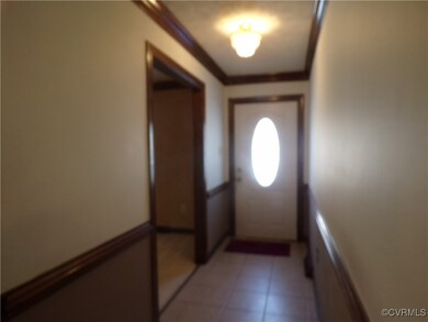Doorway featuring light tile patterned flooring an
