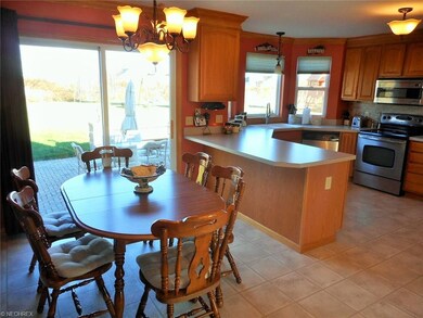 Kitchen flows directly into dinette area, with sli