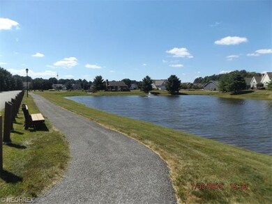 Walking trail around beautiful lake with fountain!