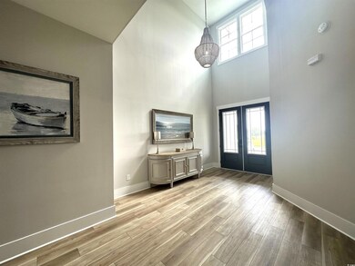 Unfurnished living room with french doors, hardwoo