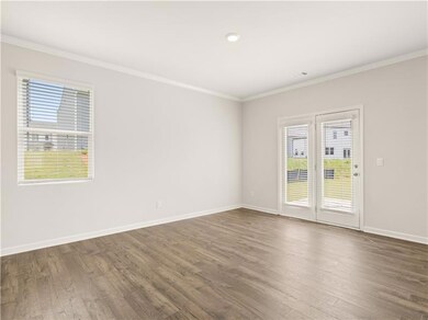Empty room with ornamental molding, dark hardwood 