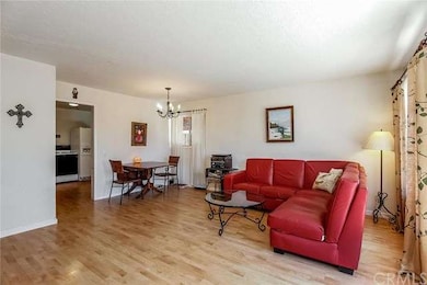 The bright, airy living room flows seamlessly to t