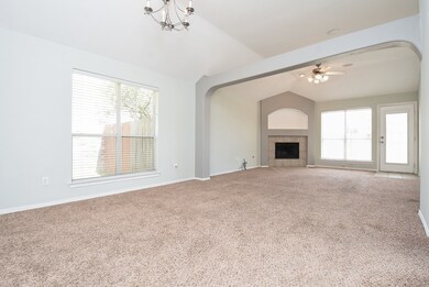 Wide open, airy space is the calling card of the open floor plan design concept, which offers clear, tremendous space, naturally featuring common areas; such as this bright and light huge carpeted living/family area.