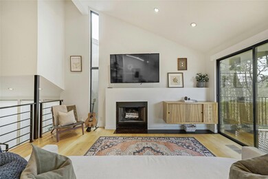 Living room with a fireplace with flush hearth, w