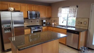 Kitchen with granite countertops and tiled backspl
