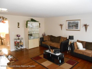 large living room with wood floors