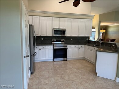 Kitchen with appliances with stainless steel finis