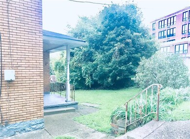 Flat and inviting back yard with covered porch