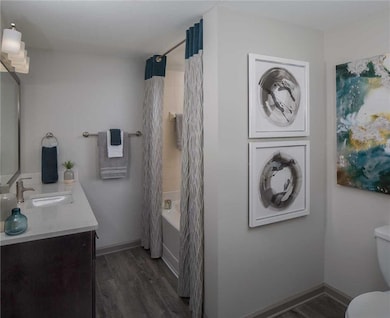 Full bathroom featuring shower / tub combo with cu