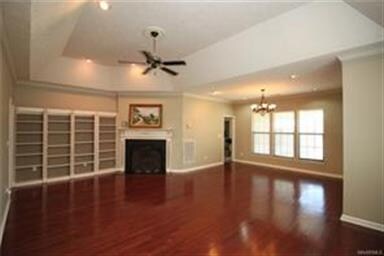 Spacious great room offers impressive wood floors,