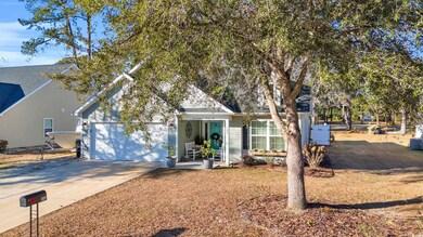 View of front of house with a garage and central A