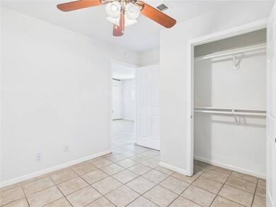 Unfurnished bedroom featuring light tile patterned