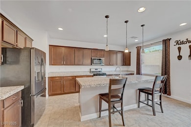 Kitchen featuring stainless steel appliances, ligh