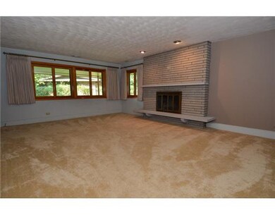 Large living rm with wood burning fireplace for th