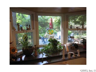 Kitchen. The pretty window over the sink looks out