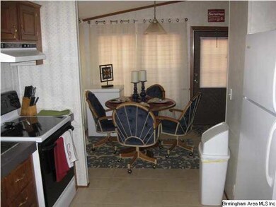 VIEW FROM KITCHEN TO BREAKFAST AREA