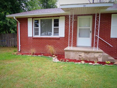 Front of house. Nice landscaping.