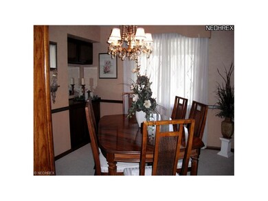 Formal Dining room with neutral carpet & Built-ins