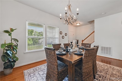 Dining room featuring a chandelier, wood finished