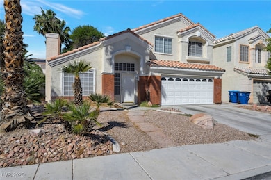 Mediterranean / spanish-style home with a chimney, a tiled roof, driveway, a garage, and stucco siding