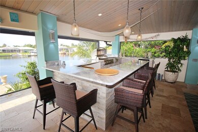 Large outdoor kitchen and bar area with great waterfront views!